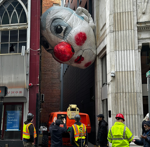 Giant head stuck in alley off Washington Street in Downtown Crossing