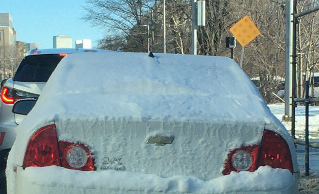 Snow covered car on Tremont Street