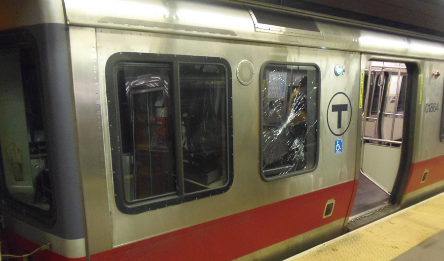 Red Line car with smashe- in window