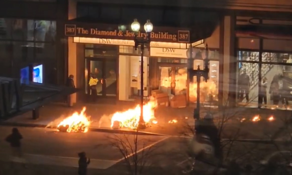 Trash on fire on Washington Street in Downtown Crossing