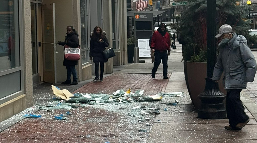 Smashed window bits lying on Washington Street