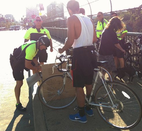 Police giving out free helmets to bicyclists without them