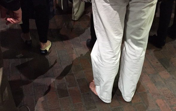 White pants and no shoes at Davis Square on the Red Line
