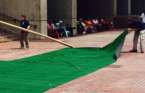 Putting down Astroturf in front of Boston City Hall