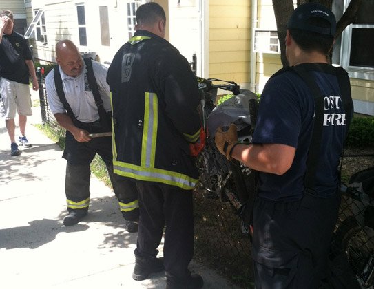 Firefighters cutting bolts on dirt bikes at Mission Main project