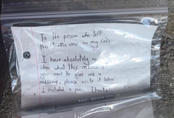 A note asking for an explanation of a cone on a car in Brighton