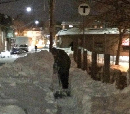 Ed Coppinger shoveling a bridge in West Roxbury