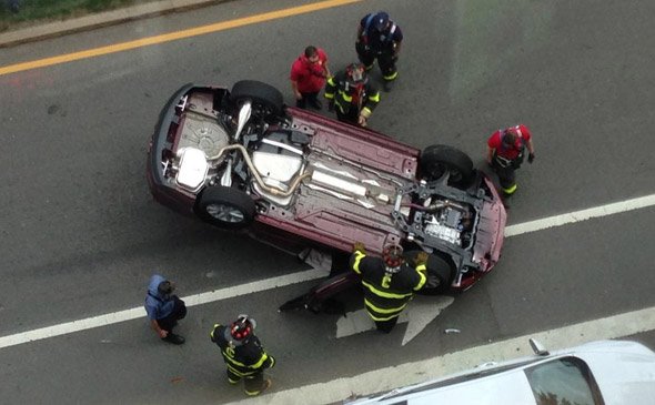 Car on its roof in Kendall Square