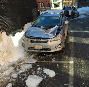 Subaru crushed by falling ice in Fort Point, Boston