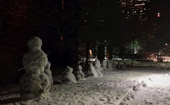 Family of snowmen on the Southwest Corridor in the South End