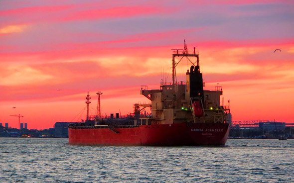 Ship coming into Boston Harbor at sunset