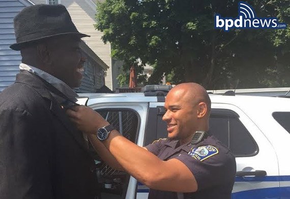 BPD officer fixes man's tie