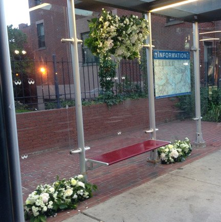 Flowers bedeck an MBTA bus stop in the South End