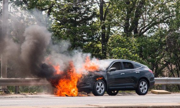 Car on fire on I-93 in Milton