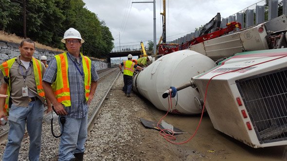 Cement truck that overturned on commuter-rail tracks in Chelsea