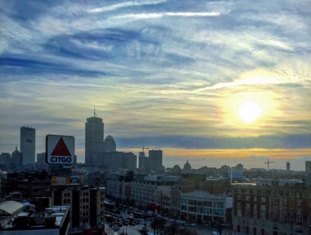 Sun rising over the Citgo sign and Kenmore Square in Boston