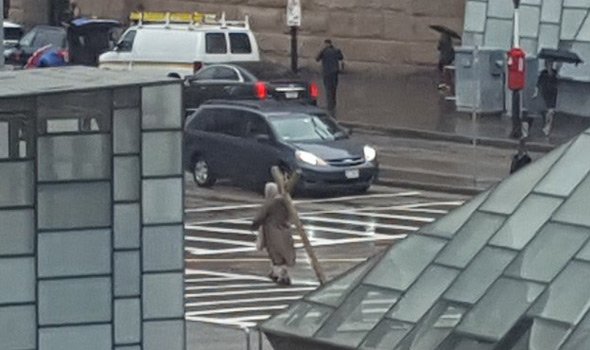 Guy with large Cross near South Station