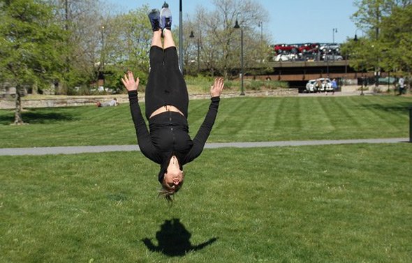 Woman doing a flip in Paul Revere Park in Charlestown