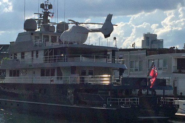 Helicopter on a boatd docked by Long Wharf in Boston