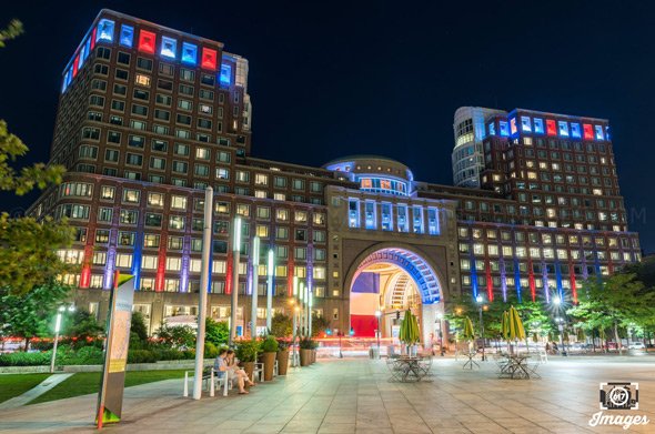 Rowes Wharf lit up in support of France