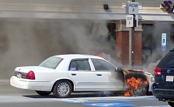 Car on fire at Quincy supermarket
