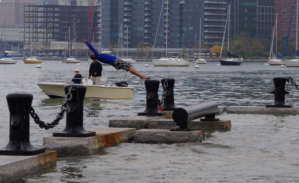Guy diving into Boston Harbor during king tide