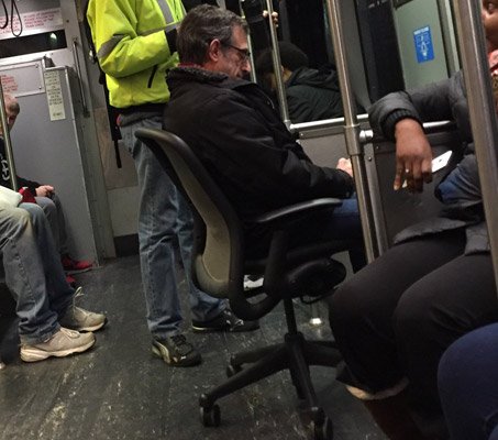 Man gets a seat on the Red Line