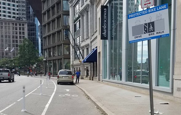 Car parked in bike lane in downtown Boston