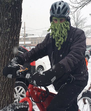 Bicyclist in weird ski mask in Cambridge