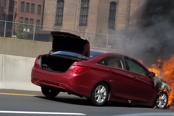 Flaming car on the Massachusetts Turnpike
