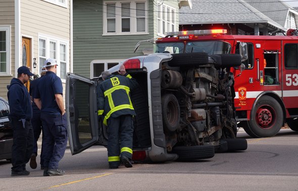 Partially flipped SUV in Roslindale