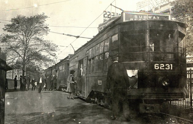 People boarding a streetcar in old Boston