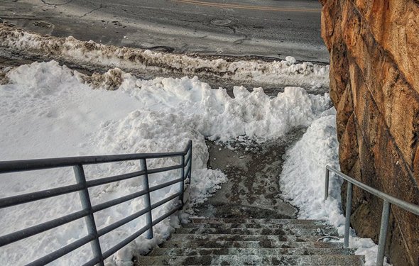 Two crews shoveled snow at Readville station, yet pedestrians are still having trouble
