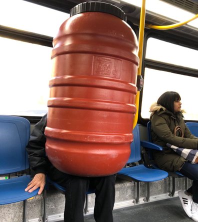 Man with barrel on the 32 bus