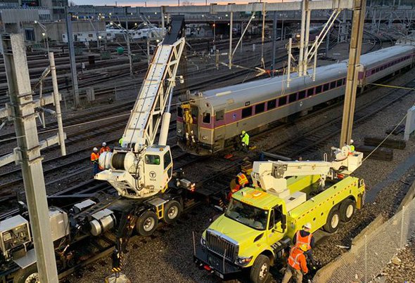 Working to right the derailed train near South Station