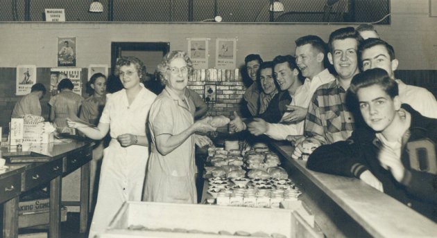Guys being served at a counter in old Boston