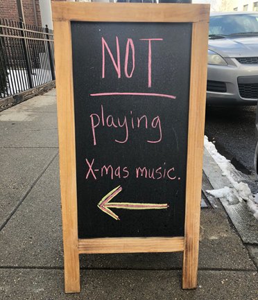 Sign that reads: NOT playing Xmas music