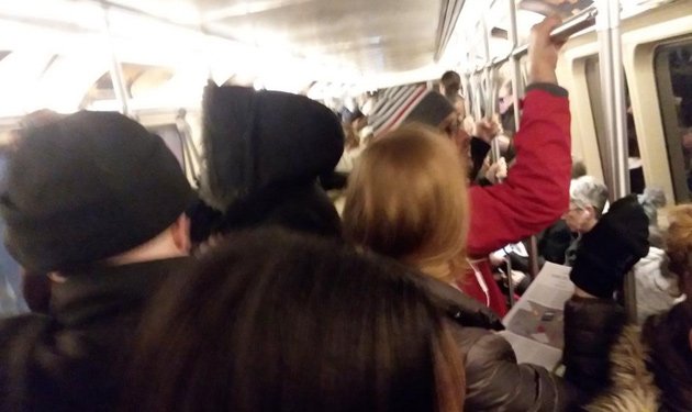 Crammed Orange Line train at Forest Hills