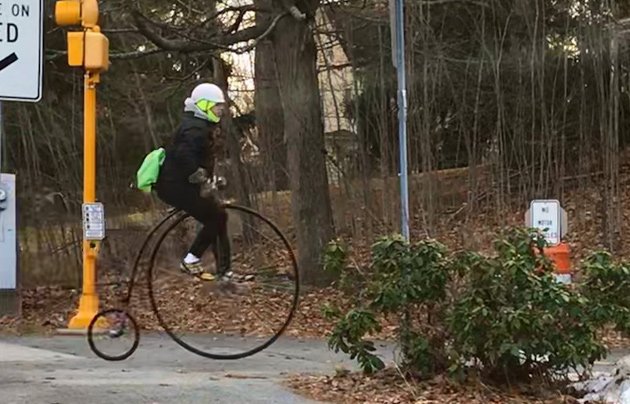 Man on a penny farthing in Lexington