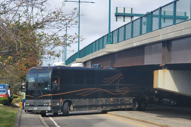 Bus stuck under Neponset River bridge in Quincy