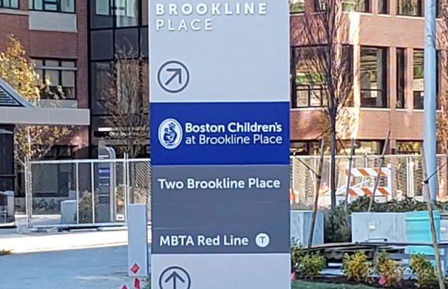 Sign in Brookline Village points to Red Line station, even though the Red Line goes nowhere near there