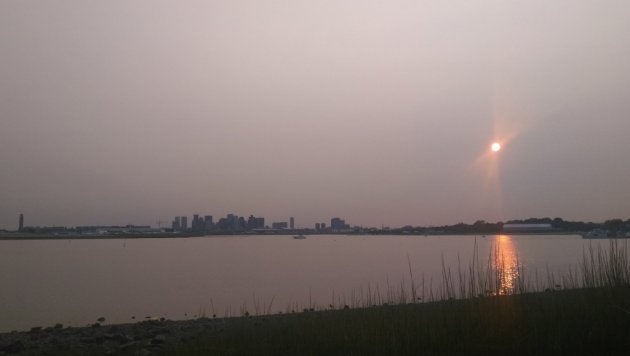 Hazy sunset over Boston Harbor from East Boston