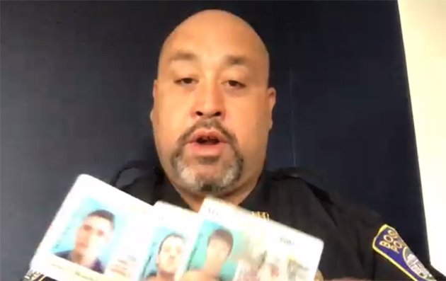 Det. Eddie Hernandez with fake Massachusetts licenses from Applebee's