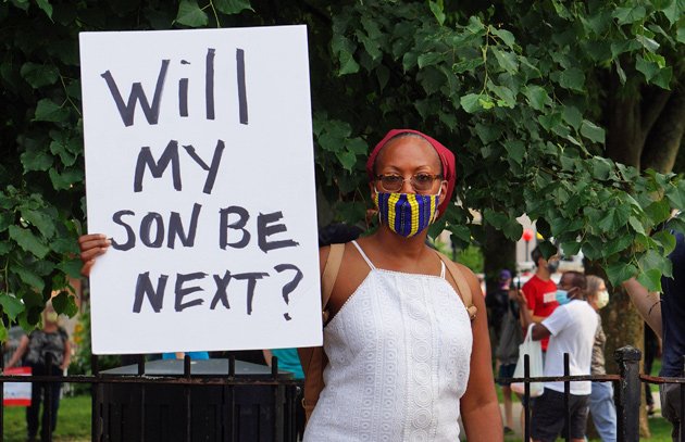 Woman with sign: Will my son be next?