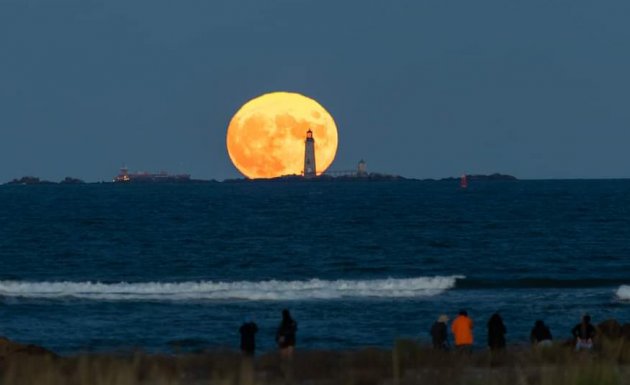 Harvest moon rises over the Five Sisters off Winthrop