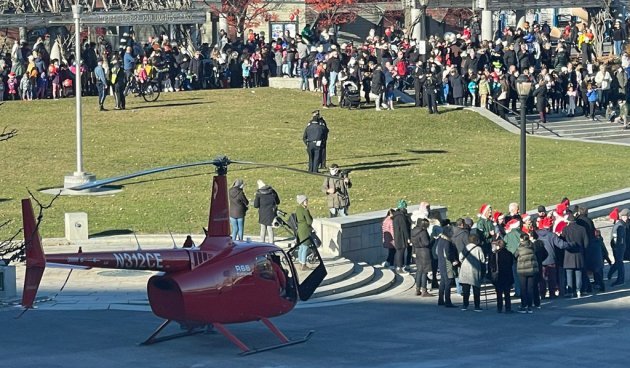Santa getting off a helicopter in the North End