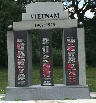 Defaced Vietnam memorial in the Rose Garden