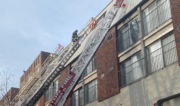 Firefighters on ladders at Symphony Road