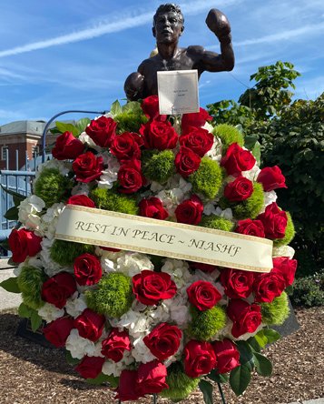 DeMarco statue with memorial wreath