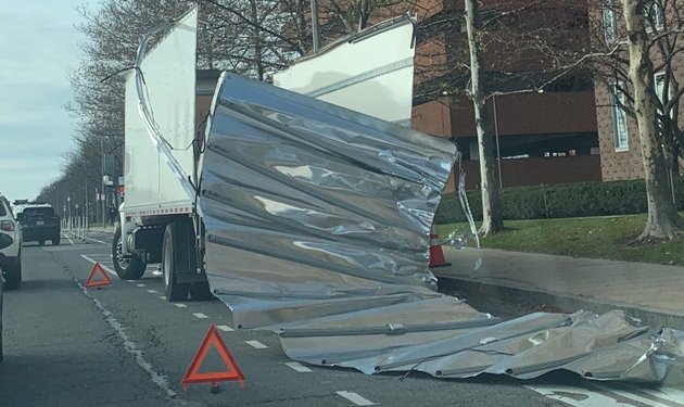 Box truck now playing the role of a sardine can on Western Avenue.